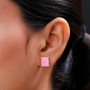 pink jadeite jade cushion stud earrings in rhodium over sterling silver shown in a lifestyle photo
