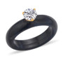 front view of round moissanite solitaire on black jade band in 18k yellow gold over sterling silver