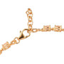 close up of imperial garnet oval tennis bracelet in 18k yellow gold over sterling silver