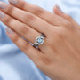 blue zircon champagne and white zircon ring in rhodium over sterling silver worn on a hand