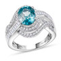 front view of blue zircon oval and moissanite bypass ring in rhodium over sterling silver