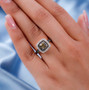 golden tanzanite champagne and white zircon double halo ring in 18k yellow gold over sterling silver worn on a hand