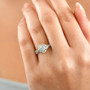lab diamond halo ring in two-tone 18k yellow gold and rhodium over sterling silver worn on a hand