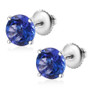 angled view of tanzanite round screwback stud earrings in 14k white gold