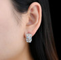 ethiopian opal earrings in rhodium over 925 sterling silver worn on the ear