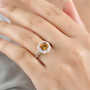 honey scapolite and moissanite halo ring in rhodium over sterling silver worn on a hand