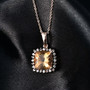 honey scapolite brown and white zircon halo pendant on dark background