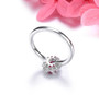 ruby and white zircon oval halo ring in rhodium over 925 sterling silver