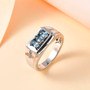 aquamarine and white zircon gents ring in rhodium over sterling silver shown in a lifestyle photo