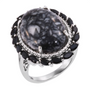 front view of an oval pinolith cabochon ring surrounded by marquise cut black spinel halo in rhodium over sterling silver