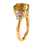 side profile of oval triphane ring showing raised prongs and moissanite accent shoulders