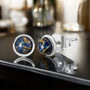 pietersite stud cabochon earrings in rhodium over sterling silver shown in a lifestyle photo