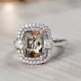 andalusite and moissanite double halo ring in rhodium over sterling silver shown in a lifestyle photo