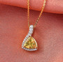 yellow apatite and moissanite pendant necklace in 18k yellow gold over sterling silver shown in a lifestyle photo