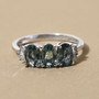 multi-color parti sapphire and diamond trilogy ring in 10k white gold shown in a lifestyle photo