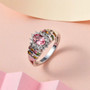 pink apatite multi tourmaline and zircon halo ring in rhodium over sterling silver shown in a lifestyle photo