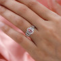 pink apatite multi tourmaline and zircon halo ring in rhodium over sterling silver worn on a hand