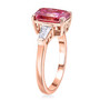 side view of pink and white moissanite solitaire ring in 18k rose gold over sterling silver