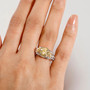 yellow and white moissanite yellow sapphire flower ring in 18k yellow gold and rhodium over sterling silver worn on a hand