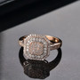 pink and white diamond cluster ring in 10k rose gold shown in a lifestyle photo