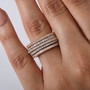 pink and white diamond cluster band ring in 18k rose gold over sterling silver worn on a hand