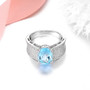 side view of sky blue topaz and white zircon ring in rhodium over 925 sterling silver