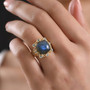 labradorite and blue apatite ring in 18k yellow gold over sterling silver worn on a hand