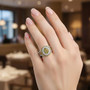 yellow diamond (ir) and white diamond cluster halo ring in rhodium over sterling silver worn on a hand