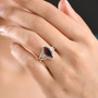 marquise garnet and moissanite ring in 18k yellow gold over sterling silver worn on a hand