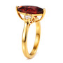 side view of marquise garnet and moissanite three stone ring in 18k yellow gold over sterling silver