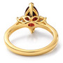 back view of marquise garnet and moissanite three stone ring in 18k yellow gold over sterling silver