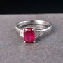 cushion ruby (ff) and moissanite ring in rhodium over sterling silver shown in a lifestyle photo