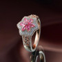 pink spinel and white zircon floral cluster ring in 18k rose gold over sterling silver shown in a lifestyle photo