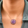 amethyst and moissanite fancy cut cocktail cluster necklace in 18k yellow gold over sterling silver worn around the neck