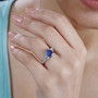 kyanite and zircon ring in rhodium over sterling silver worn on a hand