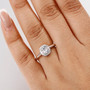 aquamarine and zircon halo ring in rhodium over sterling silver worn on a hand