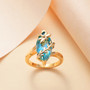 blue and green quartz triplet dragonfly ring 18k yellow gold over sterling silver shown in a lifestyle photo