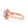 side view of pink and blue cubic zirconia halo ring in 18k rose gold over sterling silver
