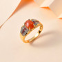 peach moonstone rhodolite and zircon gents ring in 18k yellow gold over sterling silver shown in a lifestyle photo