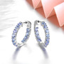 close up of tanzanite hoops in rhodium over 925 sterling silver