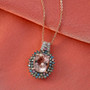 morganite and multi-color lab diamond halo pendant necklace in 18k rose gold over sterling silver shown in a lifestyle photo