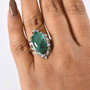 malachite and multi gemstone halo ring in rhodium over sterling silver worn on a hand