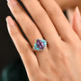 amethyst and turquoise ring in 18k yellow gold and rhodium over sterling silver on hand