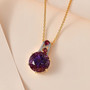 amethyst rhodolite garnet and zircon pendant necklace in 18k yellow gold over sterling silver shown in a lifestyle photo