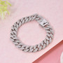 gents moissanite curb chain bracelet in rhodium over sterling silver shown in a lifestyle photo