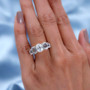white topaz seven stone ring in two-tone 18k yellow gold and rhodium over sterling silver worn on a hand