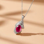 ruby (ff) black spinel and moissanite horse pendant necklace in rhodium over sterling silver shown in a lifestyle photo