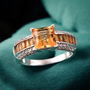 citrine and zircon ring on green background in sterling silver