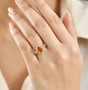 citrine and zircon ring worn on hand
