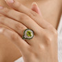 peridot and zircon ring worn on hand